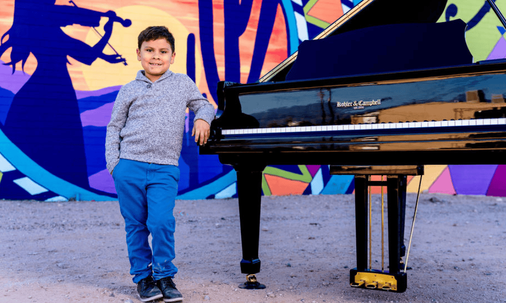 Young piano student learning a new song at Allegro School of Music and Dance in Tucson.