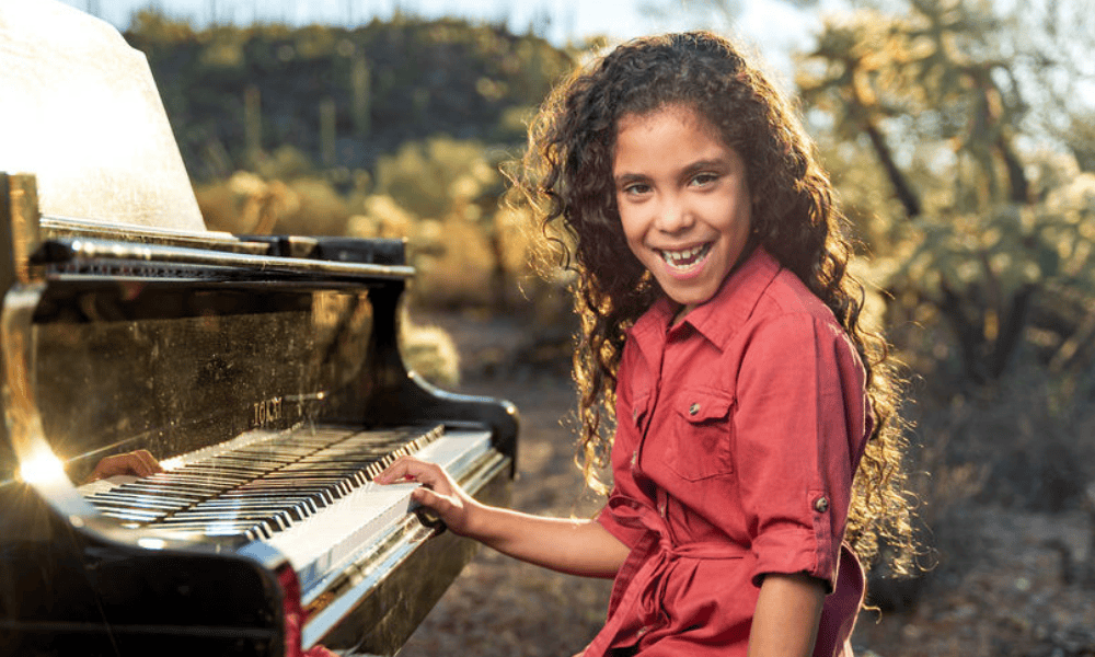 Young piano student learning a new song at Allegro School of Music and Dance in Tucson.