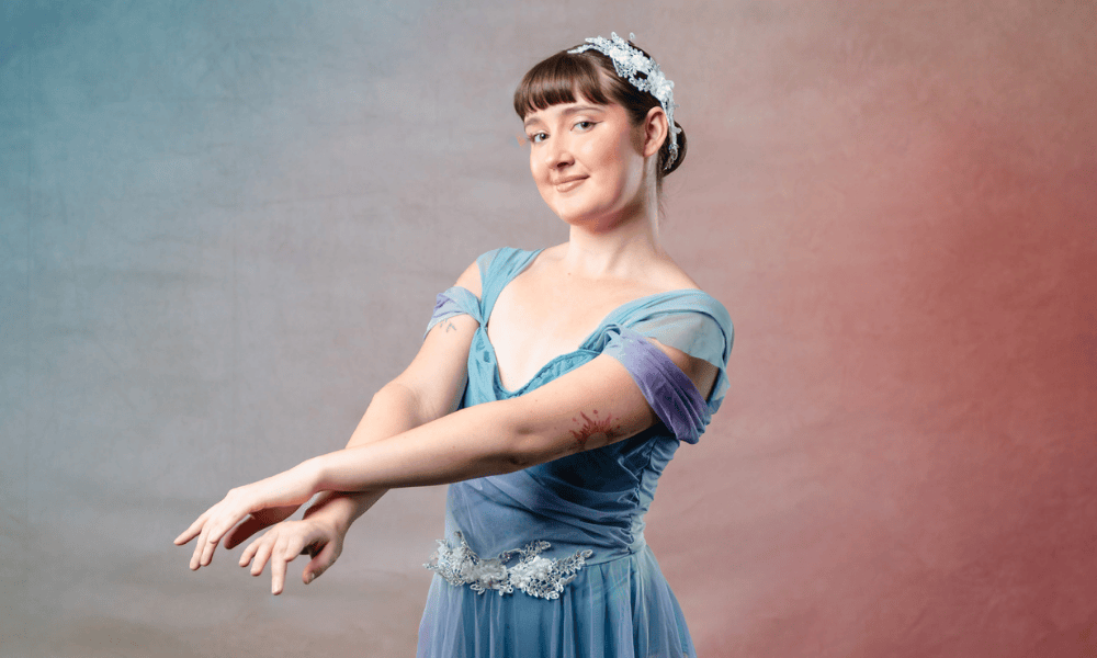 Dancer poses in costume at Allegro Eastside.