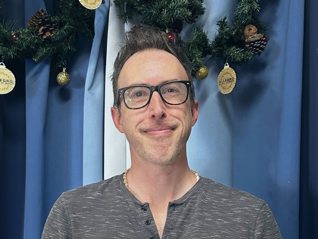 Leland, a guitar teacher at Allegro Music & Dance in Tucson