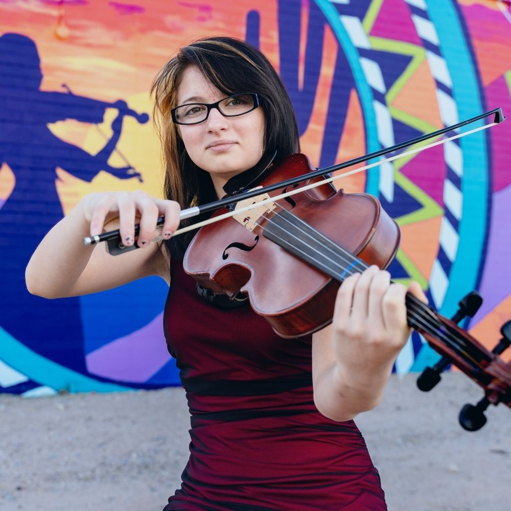 Student learning violin at Allegro Music & Dance in Tucson
